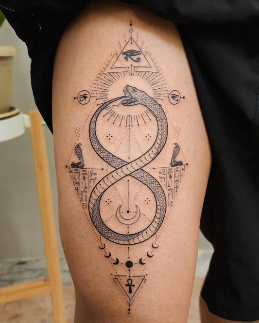 Big Geometric Ouroboros Eye Sun Tattoo on Men Thigh by @daniel.nabil_ink