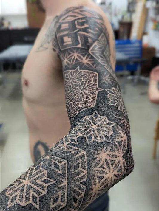 Big Geometric Snowflakes and Triangles on Men Arm Tattoo by @moodybluetattooroom