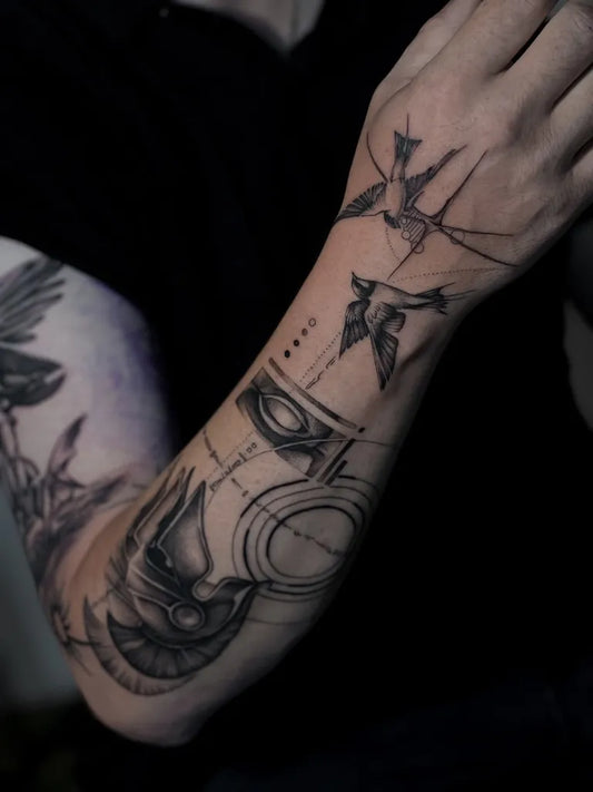 Big Geometric Swallows and Eye on Men Arm Tattoo by @gabrielepalma_