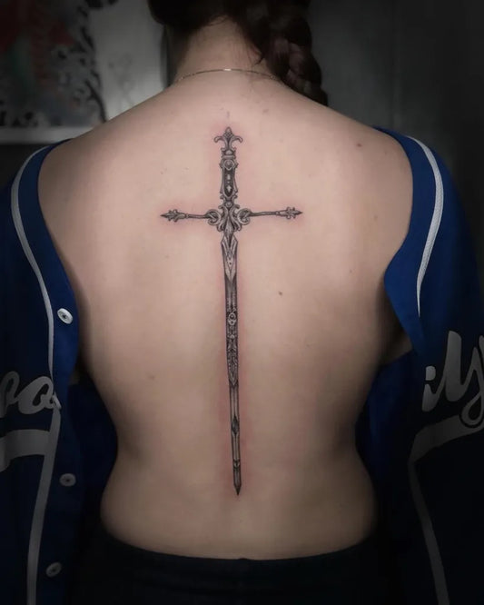 Big Gothic Ornate Cross with Sword on Women Spine Tattoo by @humankanvas