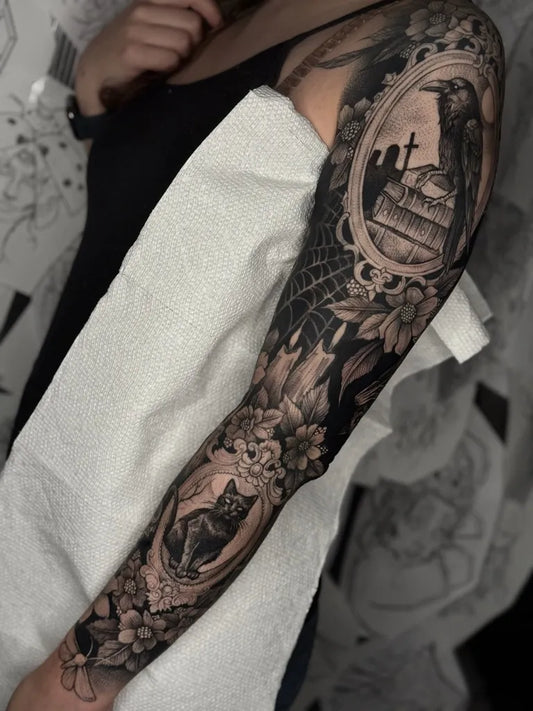 Big Gothic OvalFrameWithGraveyardAndFlowers Tattoo on Women Arm by @mattwmurray