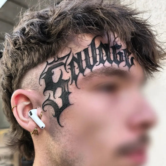 Big Gothic Swung Text on Men Face Tattoo by @vinil_one