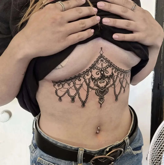 Big Henna Chandelier on Women Sternum Tattoo by @beccambtattoo