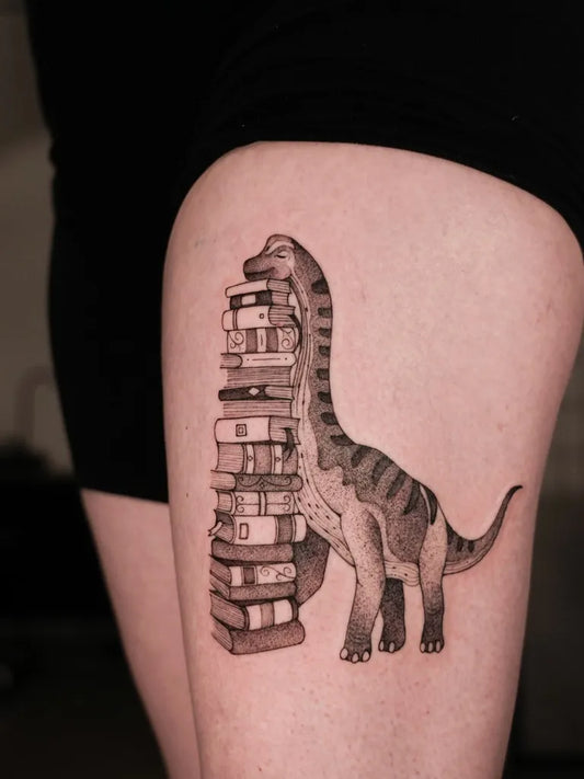 Big Illustrative Braciosaurus Stacked Books Tattoo on Women Thigh by @mariafernandeztattoo