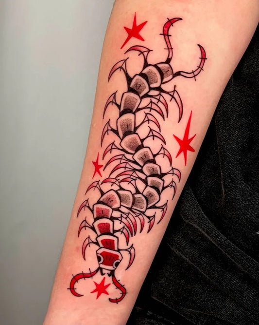 Big Illustrative Centipede with Red Stars Tattoo on Women Arm by @shlorp.tats