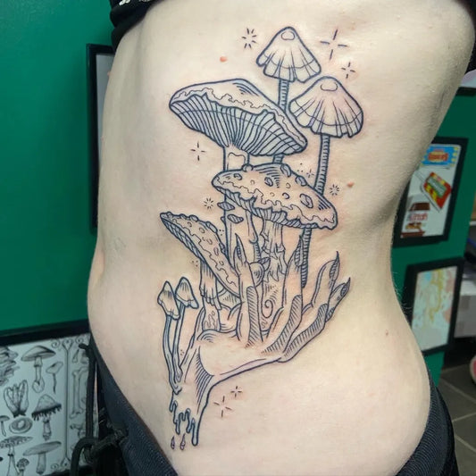 Big Illustrative Mushrooms and Hand Tattoo on Women Rib by @hashbrown_tattoos