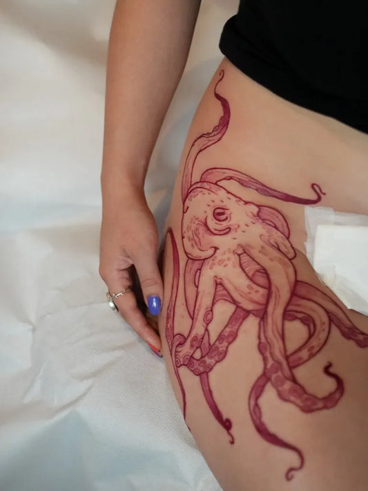 Big Illustrative Octopus Tattoo on Women Thigh by @inkarmen.tattoos