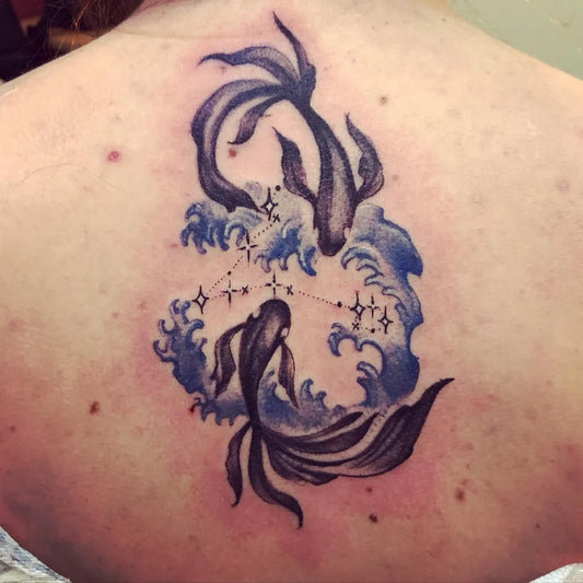 Big Illustrative Pisces Koi Tattoo on Women Back by @abigailrosetattoo