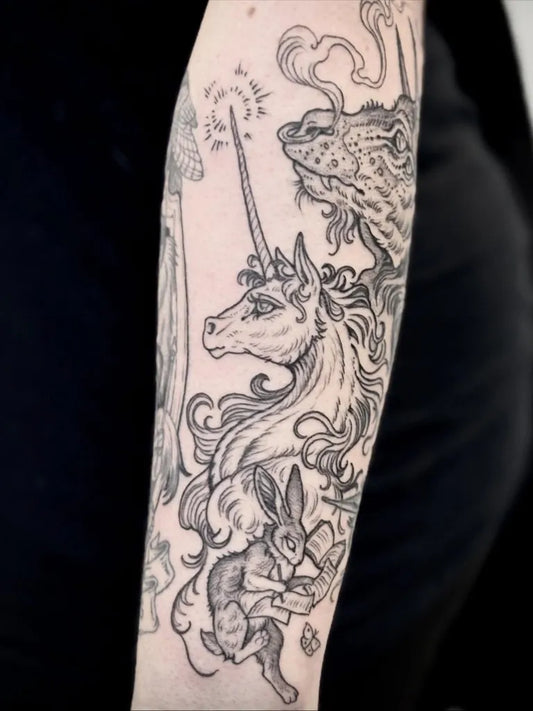Big Illustrative Unicorn Bunny Book Tattoo on Women Arm by @caitlin_hackett