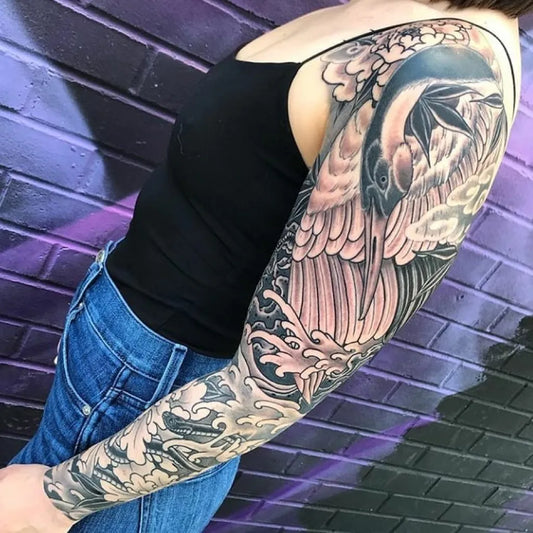 Big Irezumi Koi Waves Tattoo on Women Arm by @liquidcouragetattoo