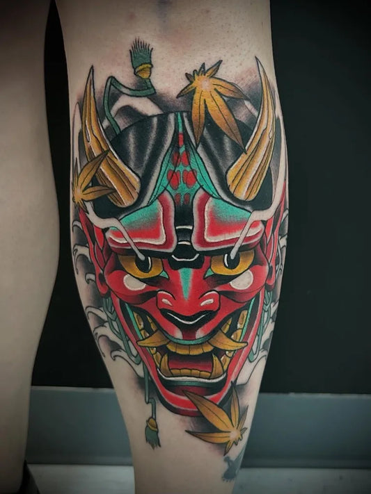Big Irezumi Oni Mask with Maple Leaves on Men Leg Tattoo by @the_combine_tattoo