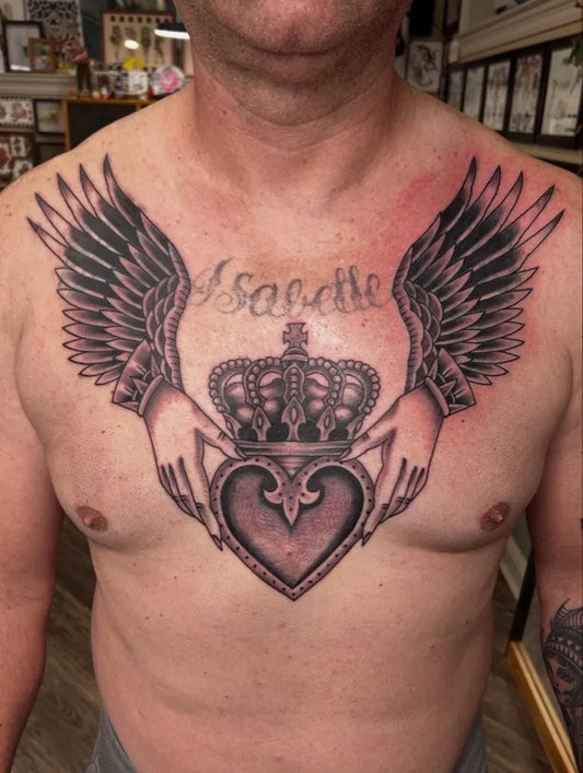 Big Irish Crown Heart Wings on Men Chest Tattoo by @nokingstattoos