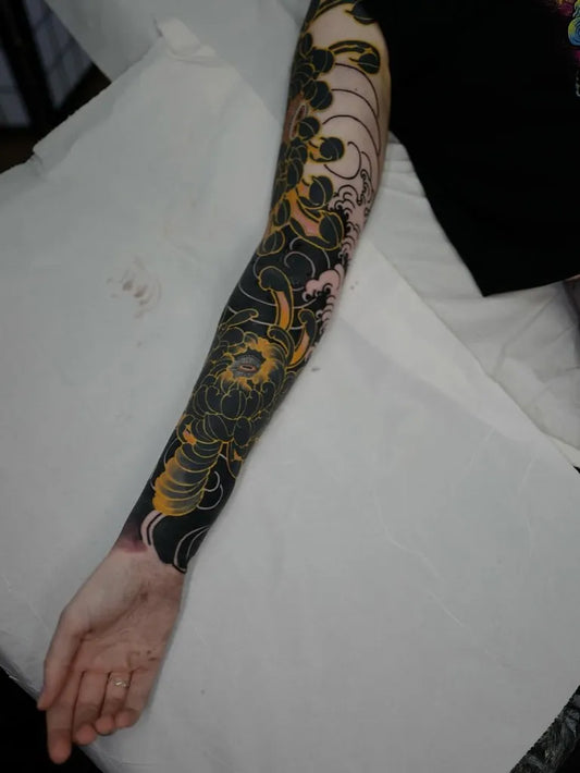 Big Japanese Black and Gold Flowers Vines on Men Arm Tattoo by @ink.japanese.ink.36