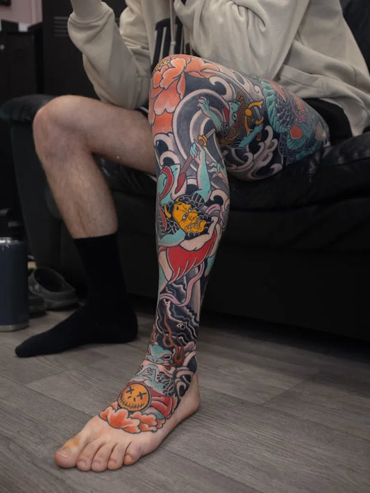 Big Japanese Dragon Flowers Waves on Men Leg Tattoo by @samforman.tattoo