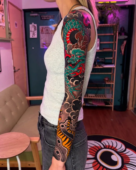 Big Japanese Dragon Waves on Women Arm Tattoo by @yoshitattoojapan