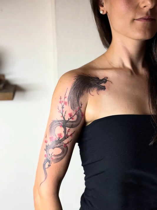 Big Japanese Dragon and Cherry Blossom on Women Shoulder Tattoo by @arzu.sagnak