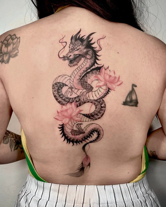 Big Japanese Dragon and Lotus on Women Back Tattoo by @trizzytattoo