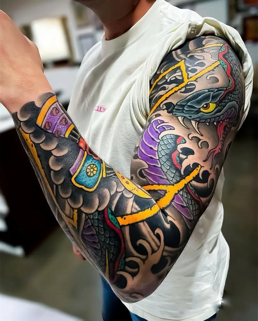Big Japanese Dragon and Snakes on Men Arm Tattoo by @traditionalstattoos