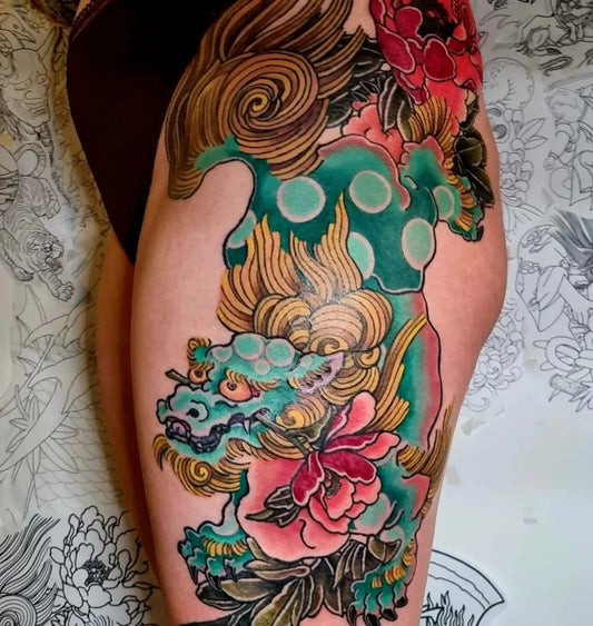 Big Japanese Foo Dog and Peonies on Women Thigh Tattoo by @emilkleintattoo