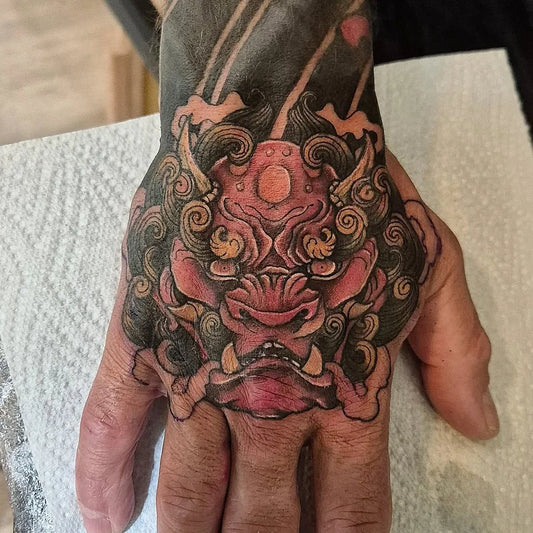 Big Japanese Hannya Mask on Men Hand Tattoo by @before_the_mast