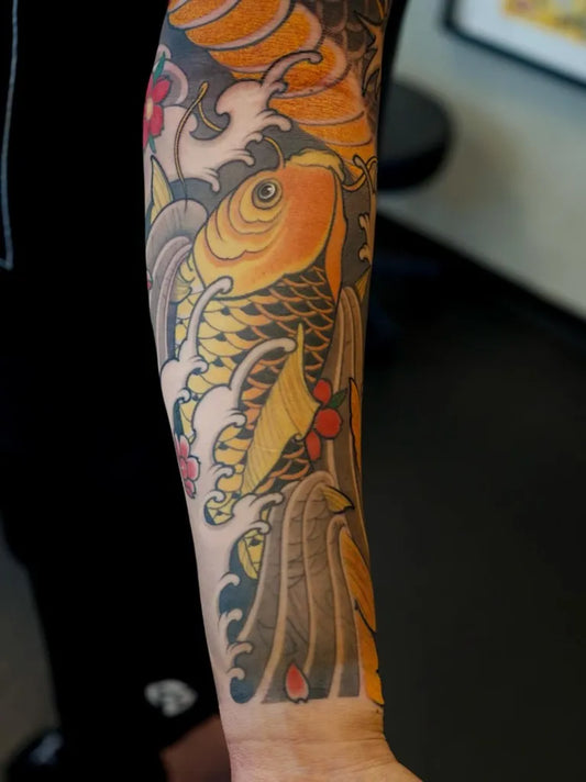 Big Japanese Koi Fish and Flowers on Men Arm Tattoo by @chrishenriksen