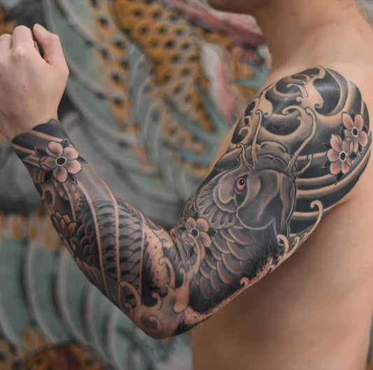 Big Japanese Koi Flowers Waves on Men Arm Tattoo by @matttelfordart