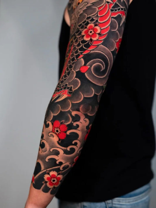 Big Japanese Koi Waves Flowers on Men Arm Tattoo by @coltonjamesphillips