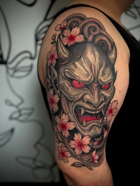 Big Japanese Oni Mask with Cherry Blossoms on Men Shoulder Tattoo by @tattedby.tay