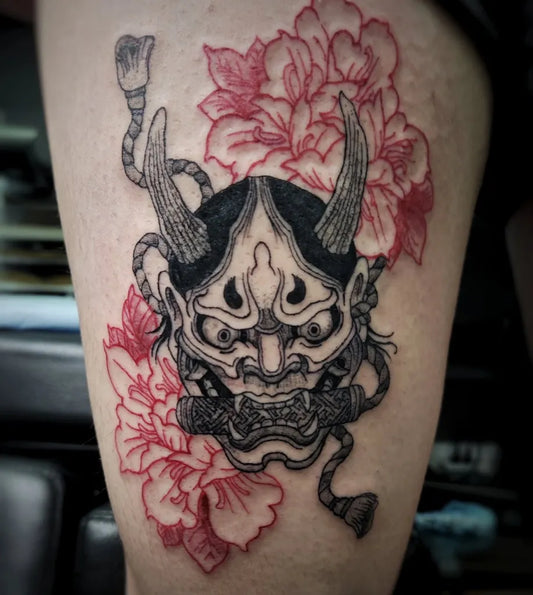 Big Japanese Oni Mask with Peonies on Women Thigh Tattoo by @brntrys.ink