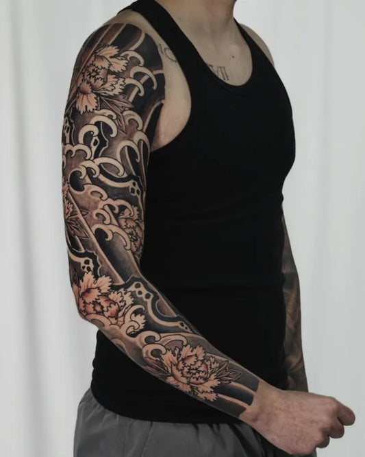 Big Japanese Peonies and Waves on Men Arm Tattoo by @jeroni_tattoos