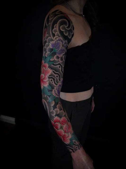Big Japanese Peonies and Waves on Women Arm Tattoo by @clintonleetattoos