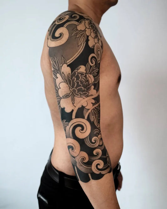 Big Japanese Peony and Waves on Men Arm Tattoo by @twinmonkeytattoostudio