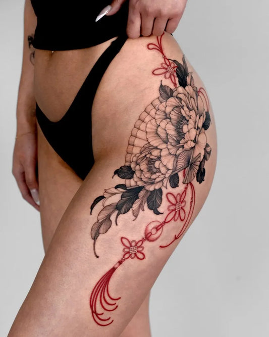Big Japanese Peony with Tassels on Women Hip Tattoo by @dobby.house