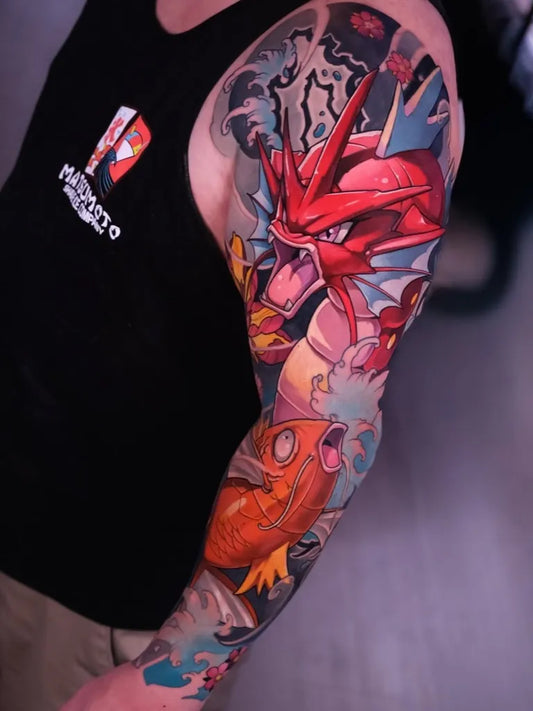 Big Japanese Pokemon Gyarados Magikarp Tattoo on Men Arm by @monna.lissa_