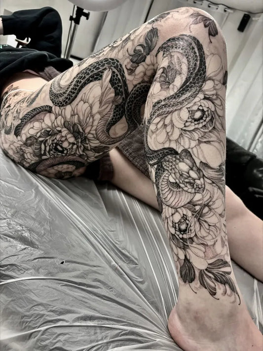 Big Japanese Snake and Peonies on Women Leg Sleeve Tattoo by @yongjuntattoo