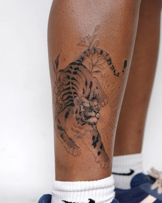 Big Japanese Tiger with Flowers and Rays on Women Leg Tattoo by @wilwang_tatt