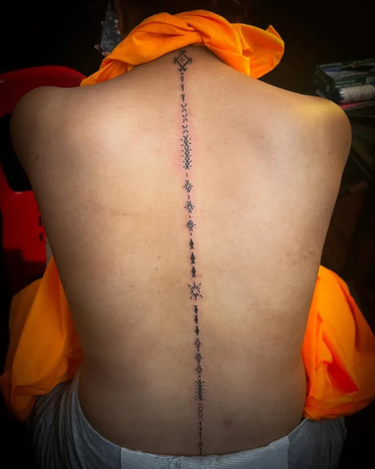Big Line Runes on Women Spine Tattoo by @kriegs_christopherr