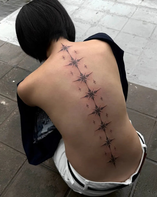 Big Line Star Chain on Women Back Tattoo by @its_banzo