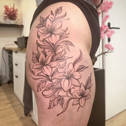 Big Linework Lily Flowers on Women Thigh Tattoo by @m.art.tattoo.nieuwamsterdam