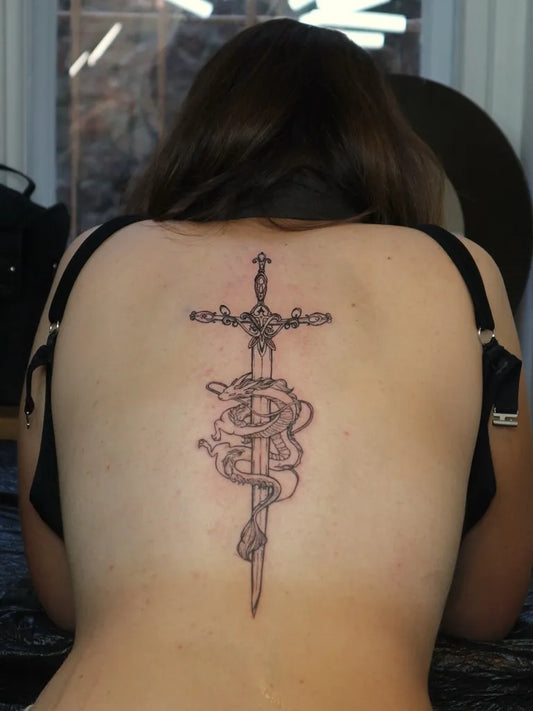 Big Linework Sword with Dragon on Women Back Tattoo by @tattoo.si_