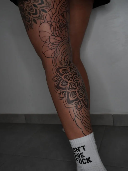 Big Mandala Flowers on Women Leg Tattoo by @serenamirolo.tattoo