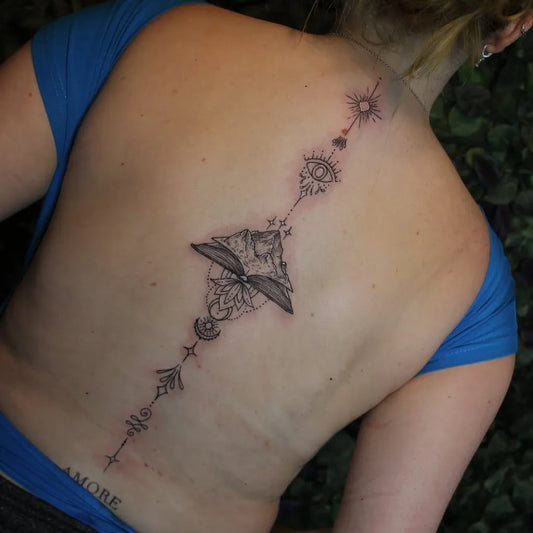 Big Mandala Mountain Book on Women Spine Tattoo by @sara_scribbles_