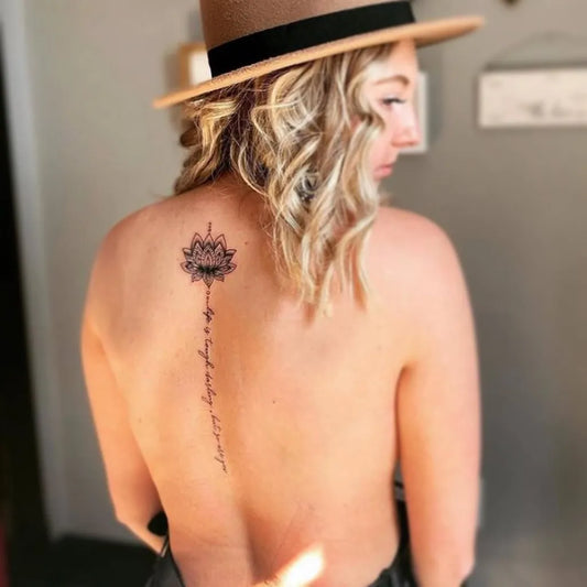 Big Mandala Script on Women Spine Tattoo by @blackgate.tattoo