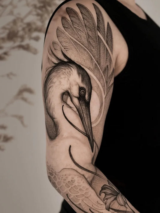Big Minimalist Heron Wings Lotus on Men Arm Tattoo by @alcaninetattoo