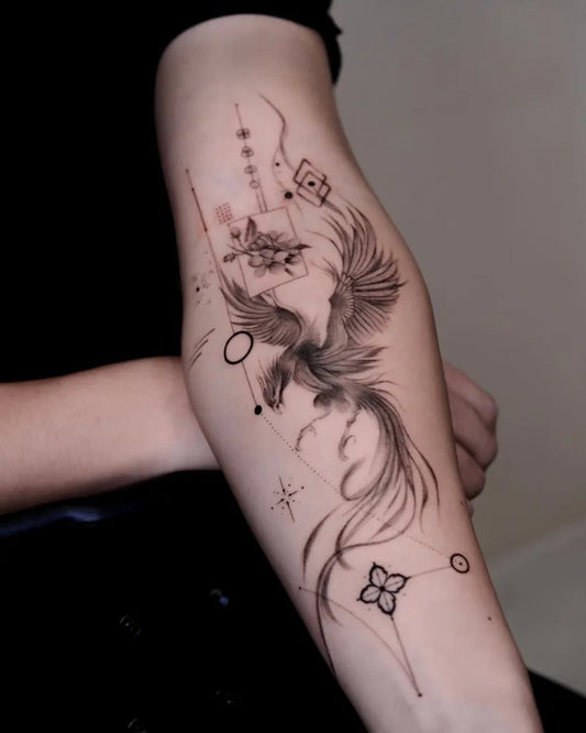 Big Minimalist Phoenix with Geometric Elements on Women Arm Tattoo by @ink.carolw