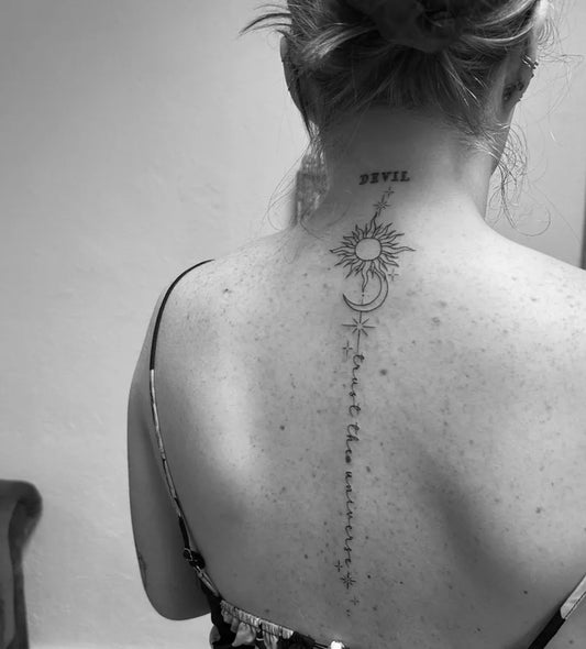 Big Minimalist Sun Moon Devil on Women Spine Tattoo by @nichtmehrallelattenamzaun