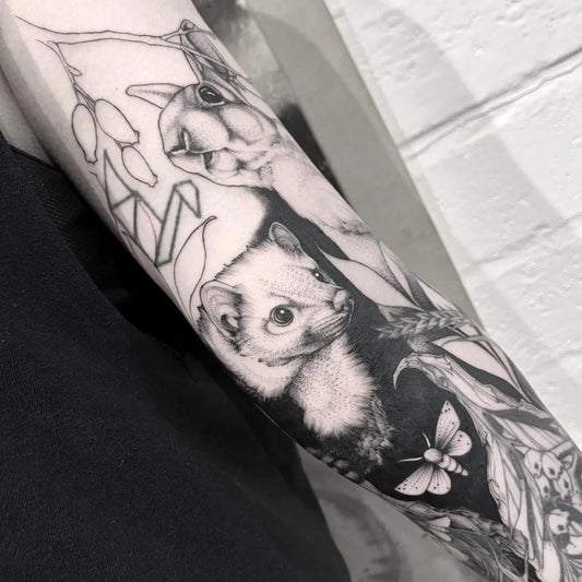 Big Negative Space Foxes Butterfly and Leaves Tattoo on Women Arm by @solemn_rose