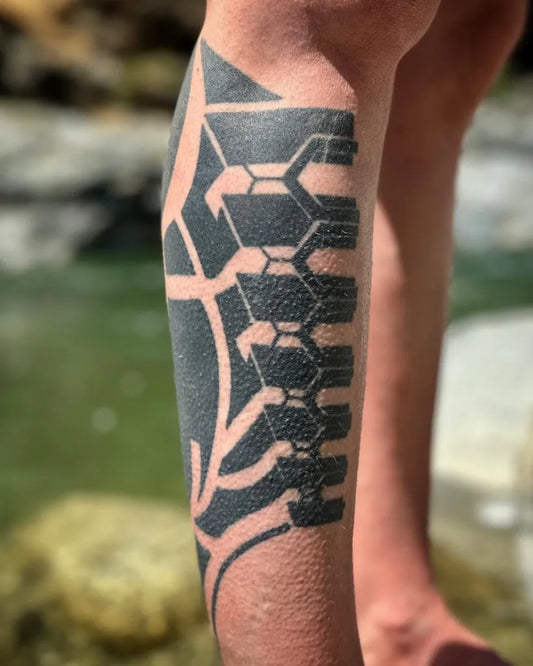 Big Negative Space Geometric Tribal Tattoo on Men Leg by @micahriot