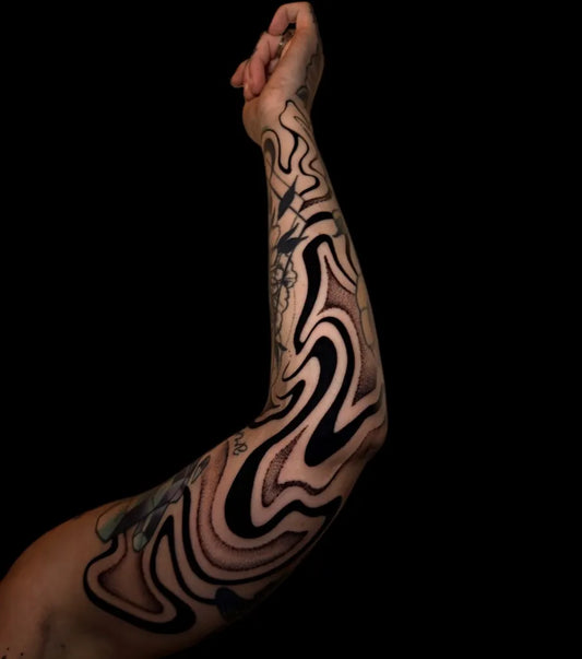 Big Negative Space Wavy Lines Tattoo on Men Arm by @inkdbydmo
