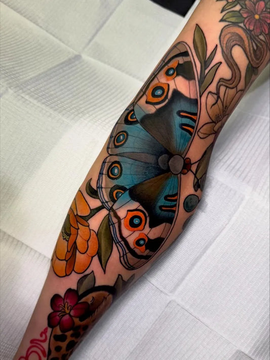 Big Neo Traditional Blue Morpho Butterfly with Flowers and Snake on Women Arm Tattoo by @torritattoos